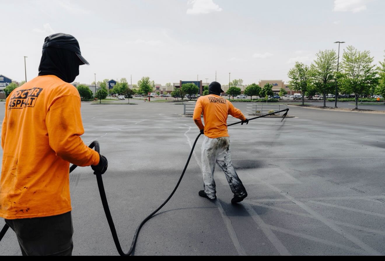 Sealcoat crew on a retail lot